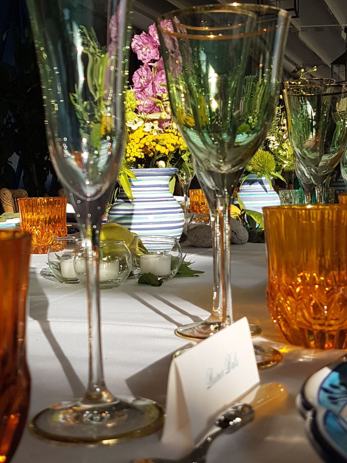 https://www.weddingamalfi.com/wp-content/uploads/Anna-and-Charles-wedding-table-colorful-decorations-with-flowers-and-place-card.jpg